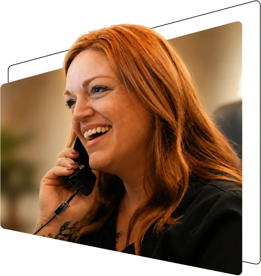 A friendly Texoma Dentures & Implants team member on the phone